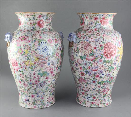 A pair of Chinese thousand flower baluster vases, Republic period, height 40cm excl. wood stands